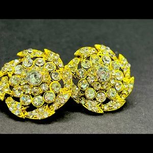 Golden crystal stud earrings.